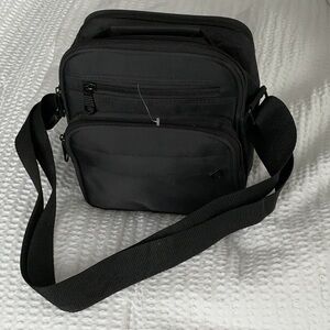 Cross-bag Black Sling small Backpack. 6-zipper  compartments NWT